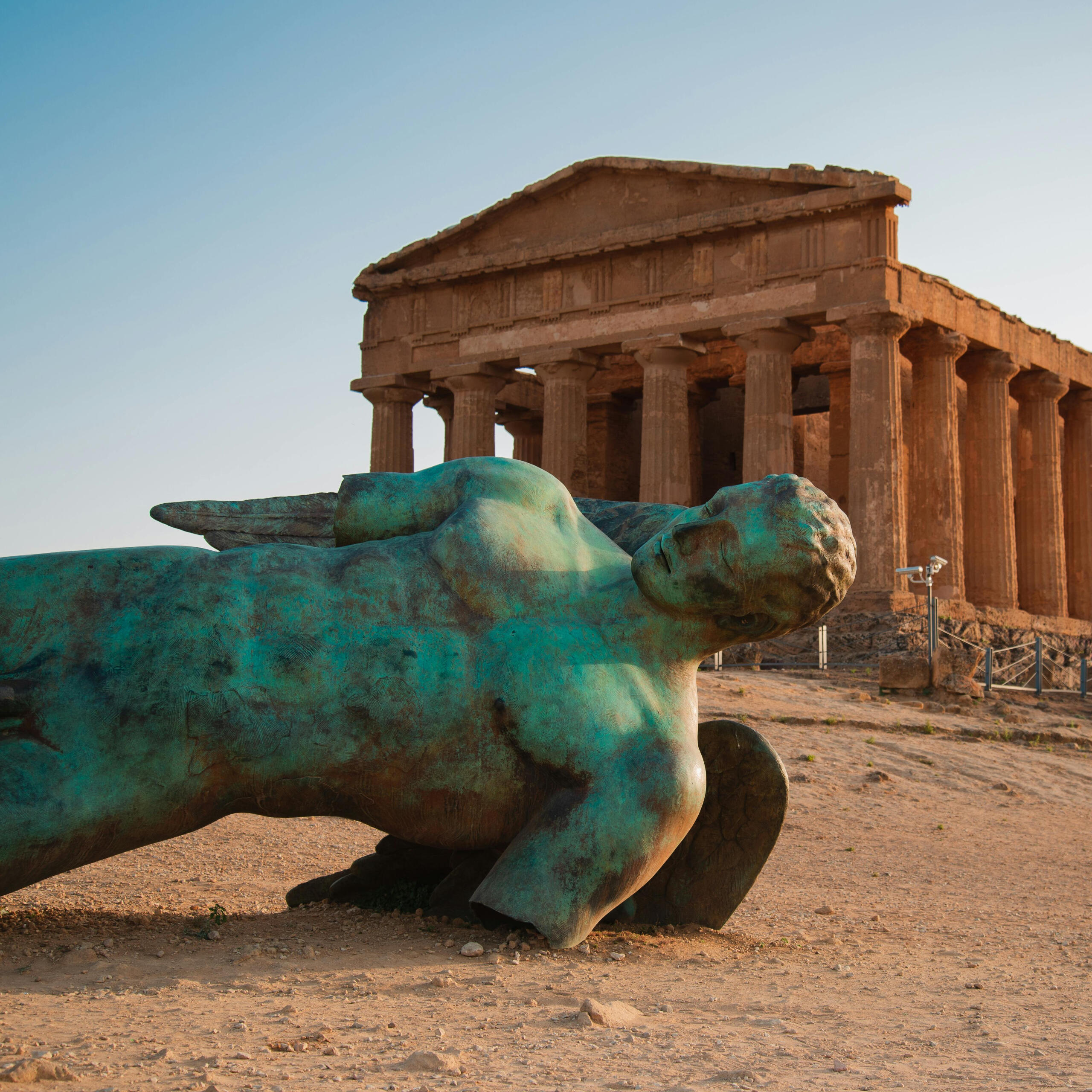 Photo by Paolo Sbalzer: https://www.pexels.com/photo/icarus-statue-in-front-of-temple-of-concordia-at-agrigento-valley-of-the-temple-sicily-10906342/